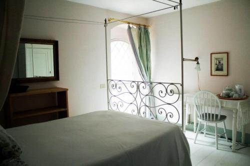 Cama ou camas em um quarto em Le Tre Colombe
