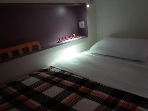a bedroom with a bed and a fireplace in it at Sakura Hostel Fethiye in Fethiye