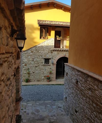 a building with a window and a stone wall at Agriturismo Feudo Gagliardi in Caulonia