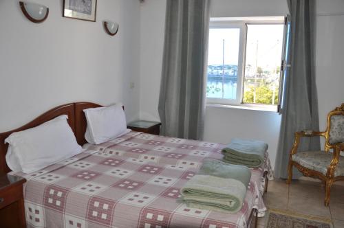 Un pat sau paturi într-o cameră la Hotel El Layeli