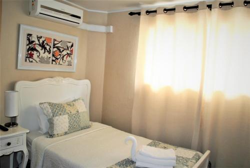 Ένα ή περισσότερα κρεβάτια σε δωμάτιο στο Hostal Pehuenche