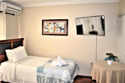 Ένα ή περισσότερα κρεβάτια σε δωμάτιο στο Hostal Pehuenche