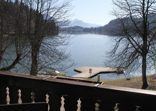 a view of a lake with a boat in the water at Penzion Zaka in Bled