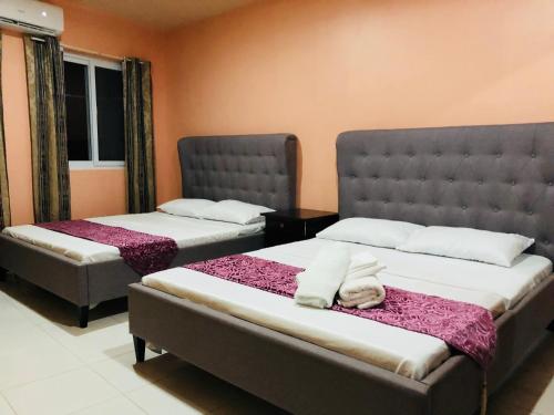 Katil atau katil-katil dalam bilik di Luzville Residences C10