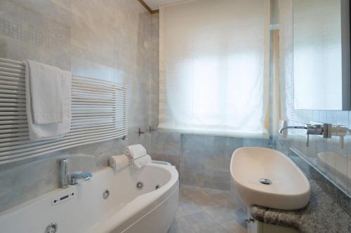 Ванная комната в Appartamenti Ora e Peler