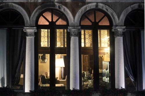 a window of a building with a lamp in it at Arcadia Boutique Hotel in Venice