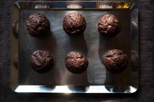 a muffin pan with chocolate muffins on it at Arcadia Boutique Hotel in Venice