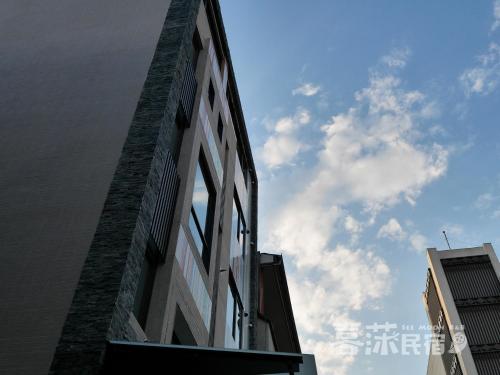 a tall building with the sky in the background at See Moon Homestay in Yuchi
