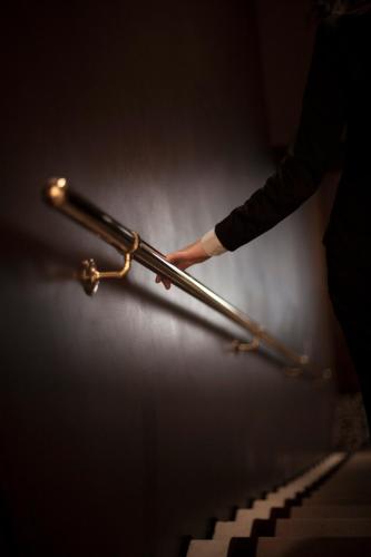a person holding a pair of tongs over a keyboard at Arcadia Boutique Hotel in Venice