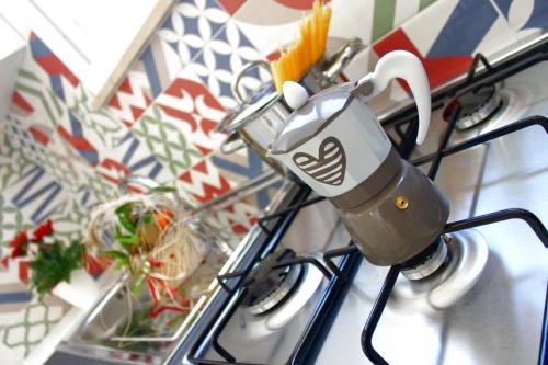 a coffee cup is on a stove top at Sirio Marsala in Birgi Vecchi