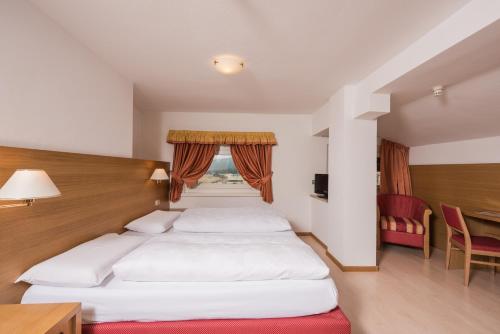 Postel nebo postele na pokoji v ubytování Hotel Union