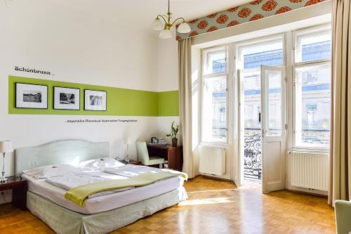 
a bedroom with a bed and a window at Pension Riedl in Vienna
