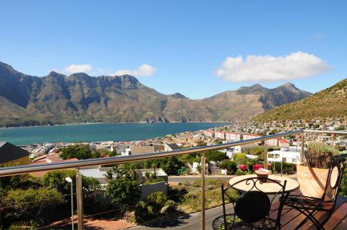 a balcony with a view of a city and mountains at Hout Bay Breeze Guest House in Hout Bay