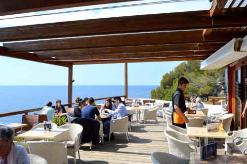 a restaurant with a view of the ocean at Charming loft - Historical Center in Tossa de Mar