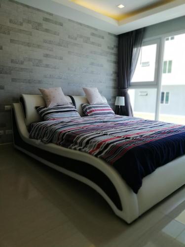 Katil atau katil-katil dalam bilik di Cosy Beach View Apartments