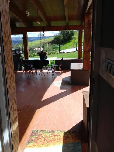 an open door to a patio with a table and chairs at Oviedo Real Spa in Oviedo