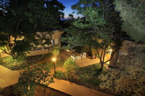 an overhead view of a backyard at night at Bar Bakfar in Sharona