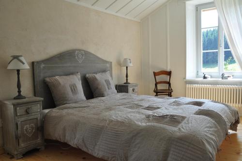 Voodi või voodid majutusasutuse Relais de la Baume toas