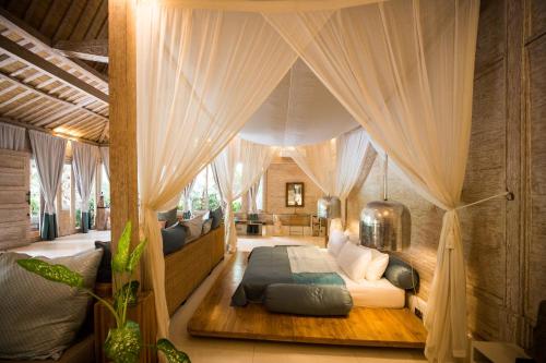 מיטה או מיטות בחדר ב-Mana Sari