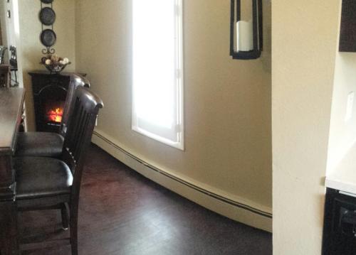 a living room with a chair and a window at Yellowstone House of the Three Bears 2 Blocks to Downtown in Cody