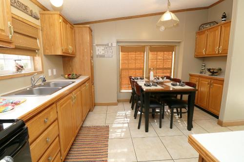a kitchen with a table and a dining room at Island Club #93 in Put-in-Bay