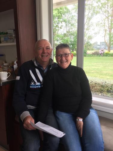 a man and a woman sitting next to a window at Seatonwood Villas in Swannanoa