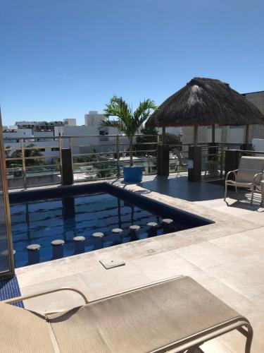 Bazén v ubytování Condo Mar Arena nebo v jeho okolí