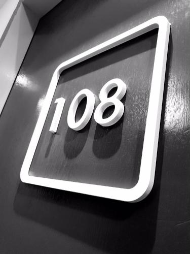 a close up of a sign with the number at Qlio Hotel in Kota Kinabalu