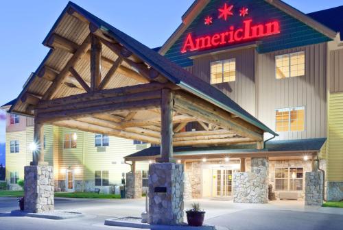 a inn with a sign on the front of it at AmericInn by Wyndham Fargo Medical Center in Fargo