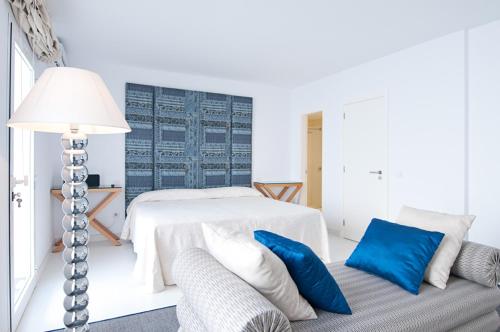 Postel nebo postele na pokoji v ubytování Villas Pasito Blanco