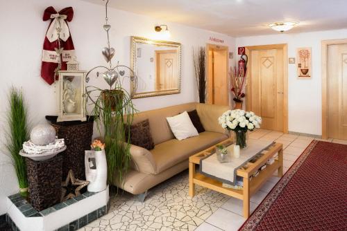a living room with a couch and a table at Haus Central in Serfaus