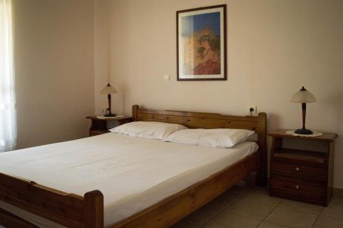 Postel nebo postele na pokoji v ubytování Olive Grove Zakynthos