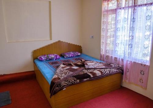 Ένα ή περισσότερα κρεβάτια σε δωμάτιο στο Hotel Chachoo Palace