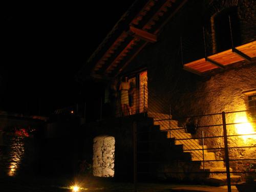 a building at night with a light on the side at Le Coffret in Saint Marcel