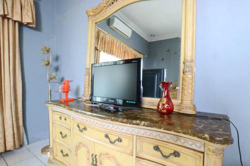 En tv och/eller ett underhållningssystem på Villa Sri Manganti
