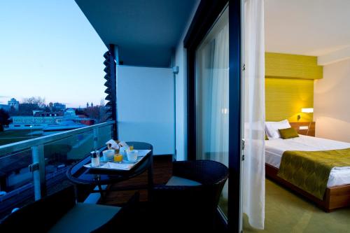 A balcony or terrace at Imola Hotel Platán
