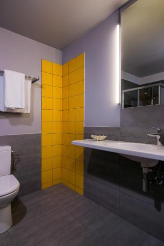 a bathroom with a sink and a toilet at Urban Donkey in Thessaloniki