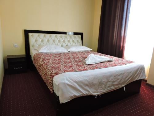 Кровать или кровати в номере Inn Kochevnik