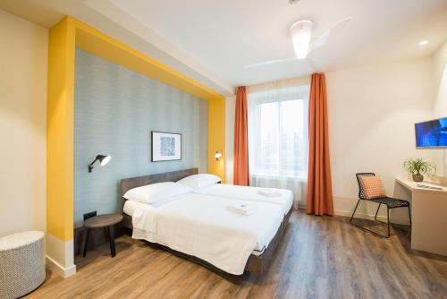 Voodi või voodid majutusasutuse Hotel Pestalozzi Lugano toas