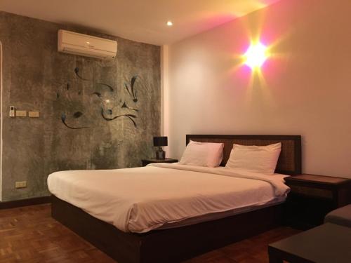 Postel nebo postele na pokoji v ubytování Cocco Resort