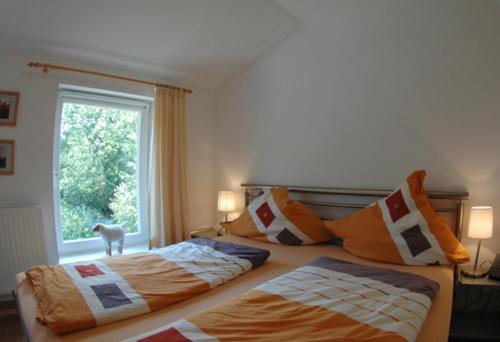 Tempat tidur dalam kamar di Hof Luisengrund