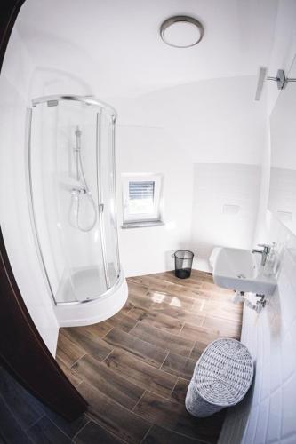 a bathroom with a shower and a sink at Villa Tower Nad Jeziorem Nyskim in Skorochow