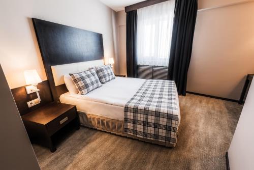 Karinna Hotel Convention Center & Spa Luxury - Full Board Plusにあるベッド