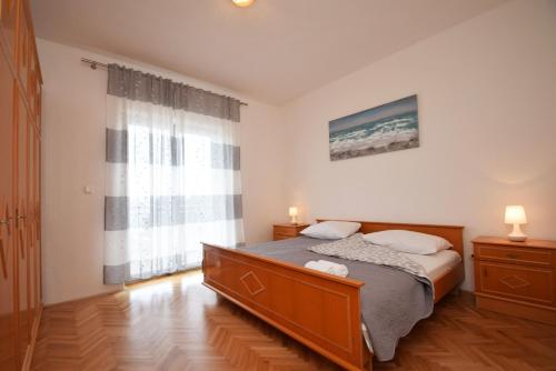 Ένα ή περισσότερα κρεβάτια σε δωμάτιο στο Apartment Duda