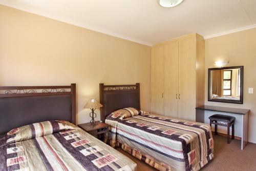 Posteľ alebo postele v izbe v ubytovaní Monateng Safari Lodge