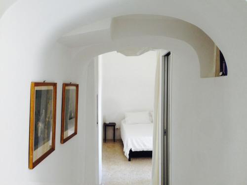 Ένα ή περισσότερα κρεβάτια σε δωμάτιο στο Casa Ricciotto