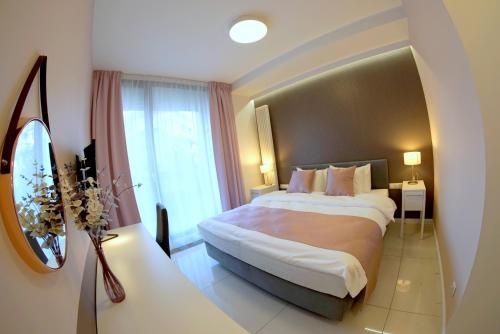 Ліжко або ліжка в номері JessApart – Ochota Apartments