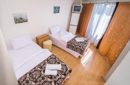 Postel nebo postele na pokoji v ubytování HOTEL ЗiРКА