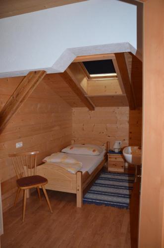 a bedroom with a bed and a sink in a room at Appartement Leirer in Alpbach