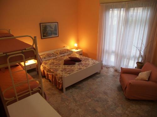 Säng eller sängar i ett rum på Villa Alessia